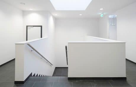 Modern staircase with black tiles.