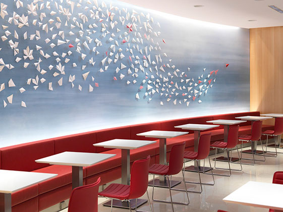 Interior view into the Air Canada Maple Leaf Airport Lounge, view on artistic wall with design like paper airplanes